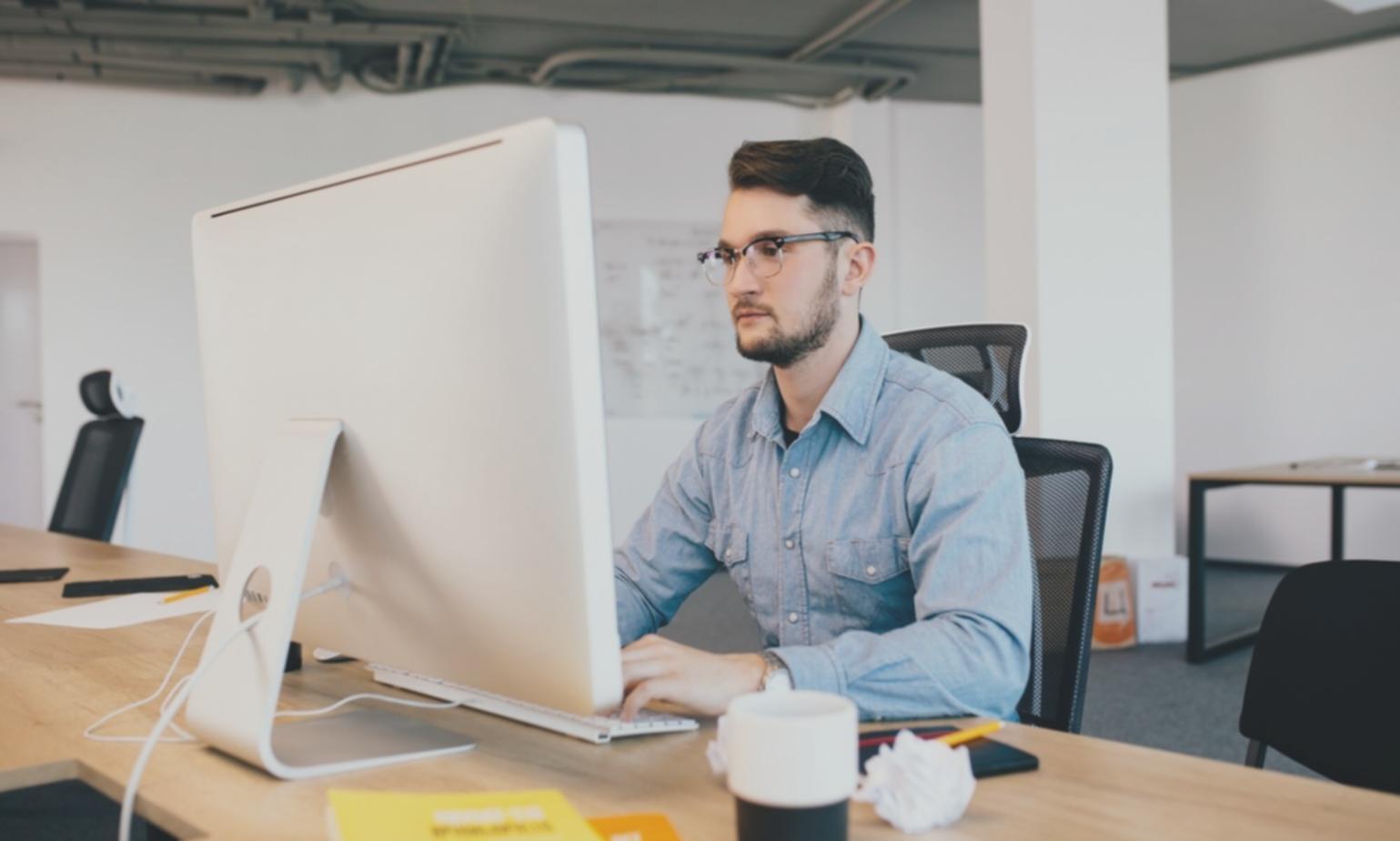 International students collaborating on blockchain projects in modern learning environment